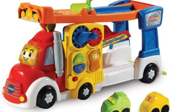 VTech Toot-Toot Drivers Big Vehicle Carrier, English Launch 2 mini vehicles down the zig-zag ramp and trap door buttons trigger phrases, songs and movement. Ages 1-5