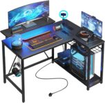 Bestier 106.5CM L-Shaped Gaming Desk with RGB LED Lights Carbon Fibre Surface, 3 Power Outlets & 2 USB Ports, Reversible Corner Desk with Shelves & Hooks for Home Office & Small Spaces