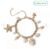 Freedom Gold Tone Pearl Shell and Metal Charm Bracelet – Free C&C