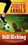 Still Kicking: A Lainie Lovett Mystery (The Lainie Lovett Mysteries Book 1) by Judith Arnold – Kindle Edition